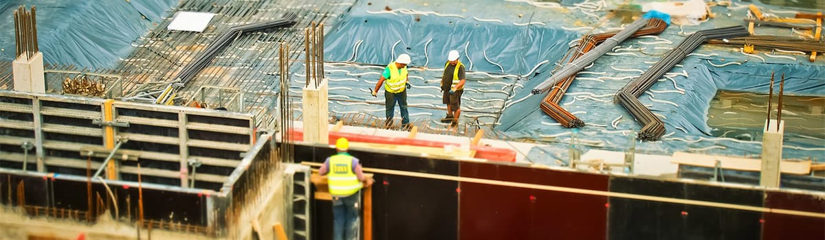 construction site with workers talking