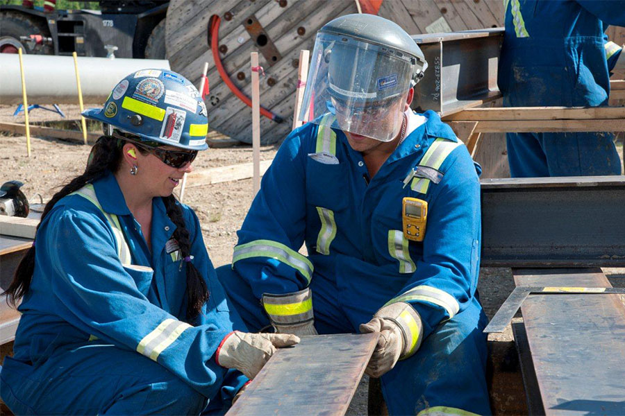 welder and metal worker discuss