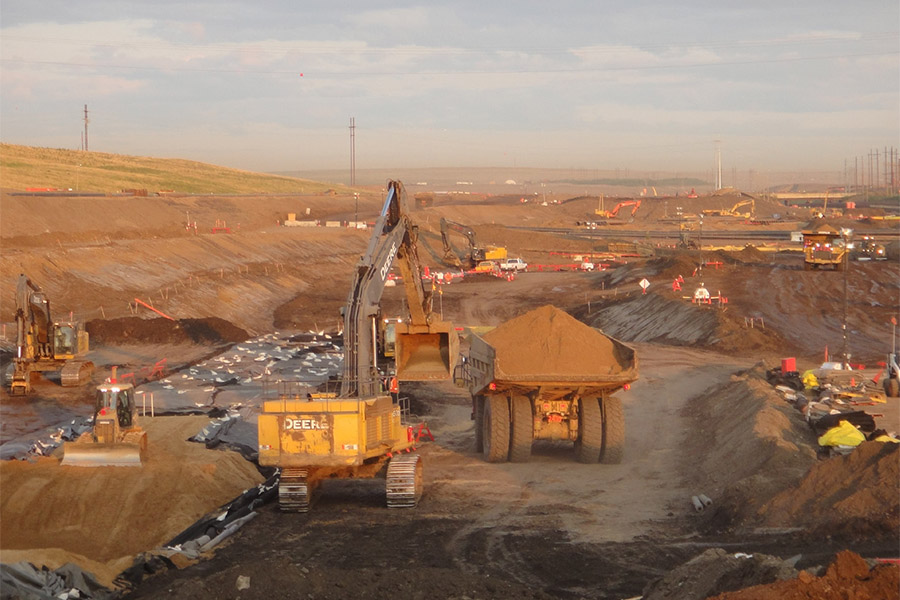 digger and truck on site